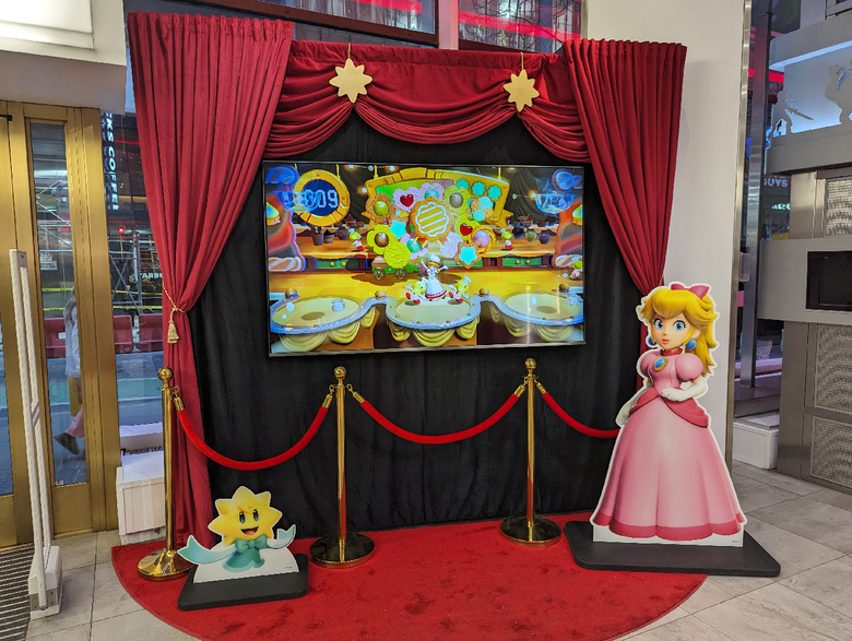 Rolling out the red carpet, this Peach display greets visitors at the entrance